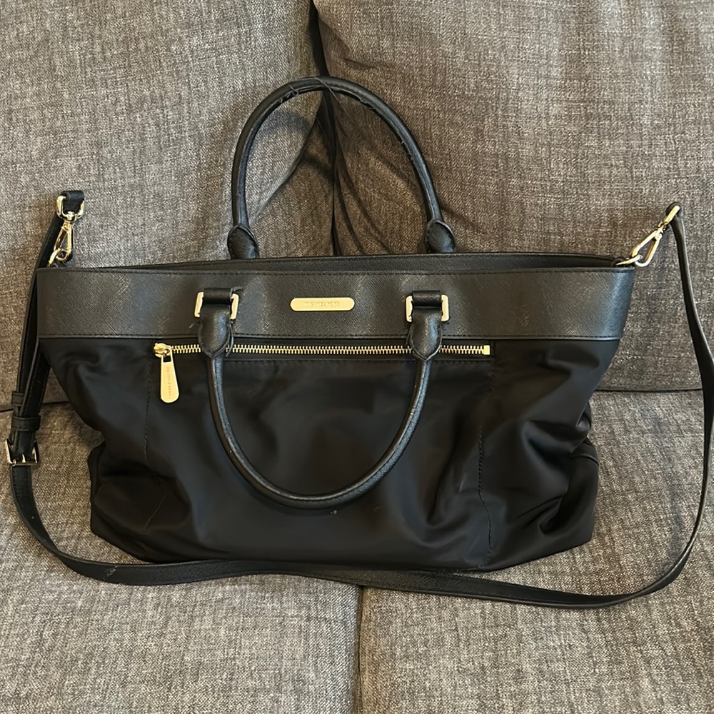 Laptop bag with multiple interior pockets and one external zipper pocket.